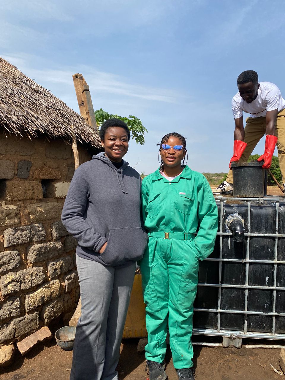 GreenBridge team beside the biogas unit